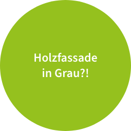 Ein hellgrüner Kreis mit der weißen Aufschrift ‚Holzfassade in Grau?!‘.“